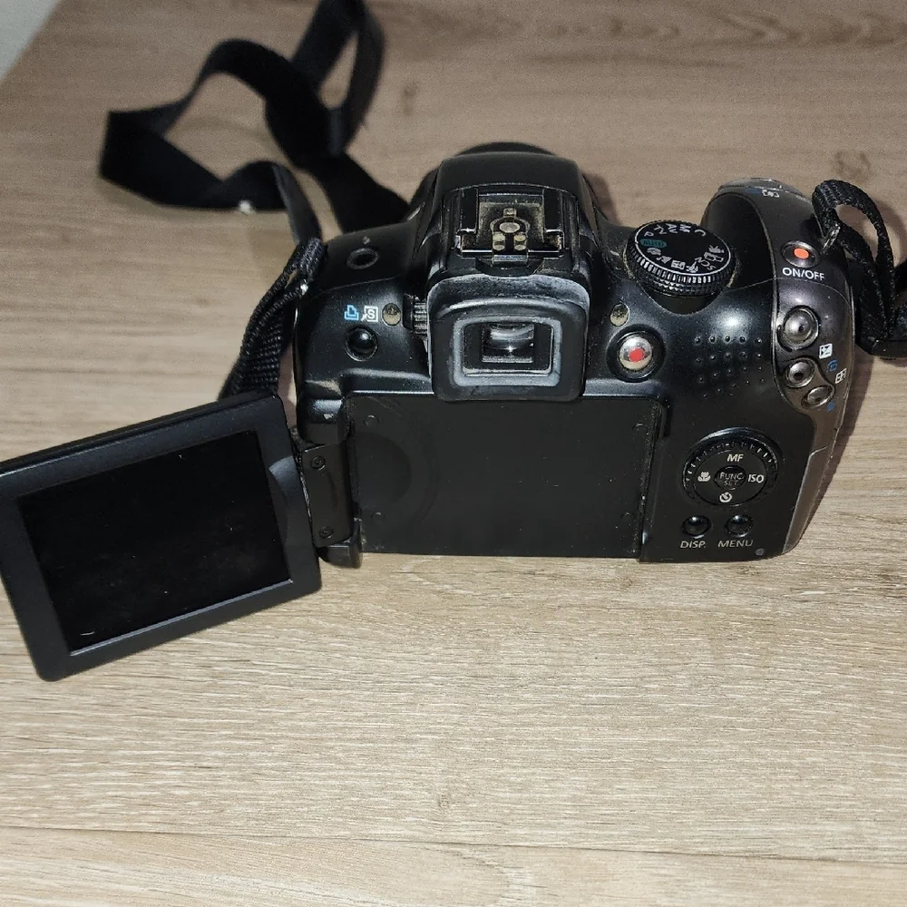 Canon Black Digital DSLR Camera with Ergonomic Grip and Optical Viewfinder